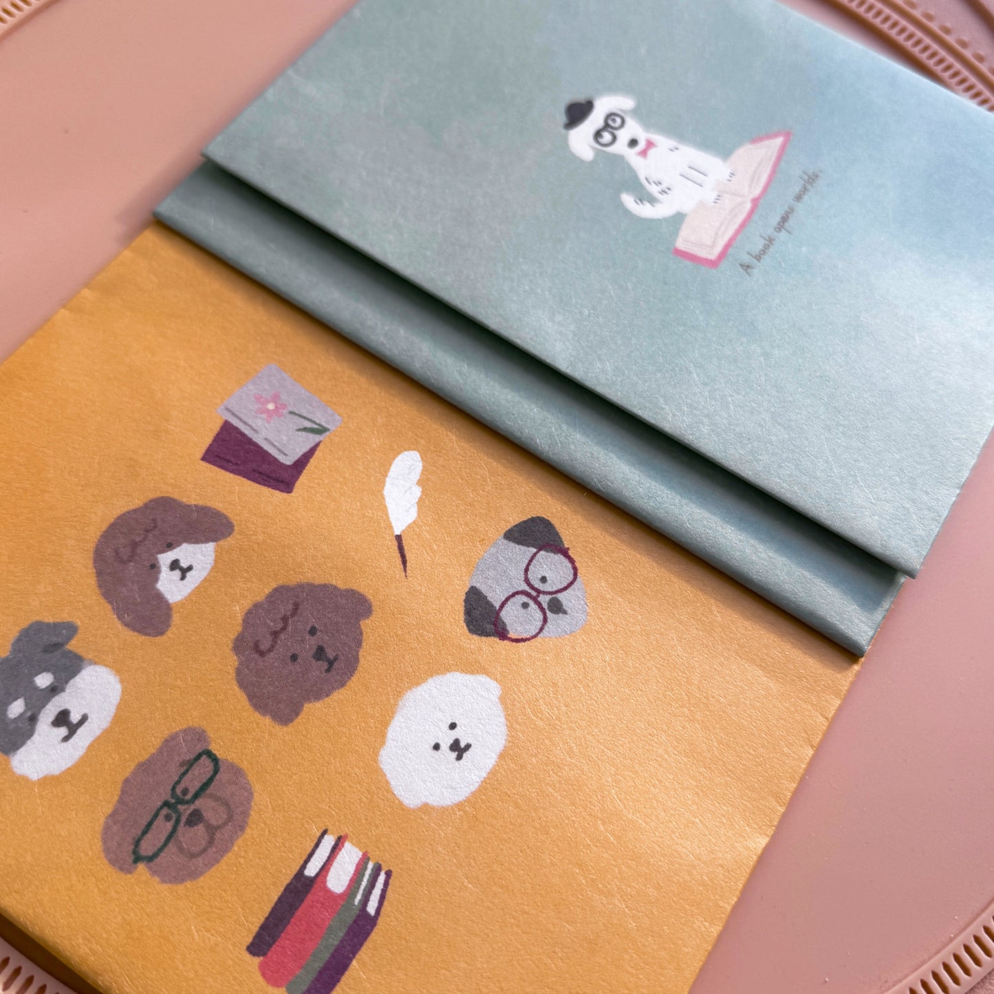 Closeup of two dog themed paper book covers