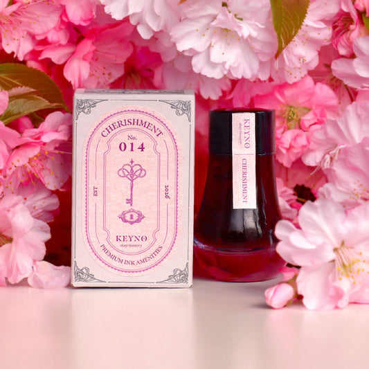 Dominant industry 'Cherishment' ink bottle and packaging with cherry blossoms in the background