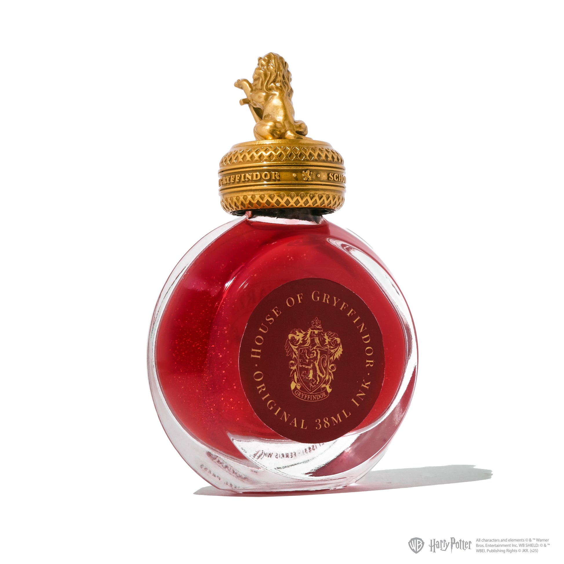 Red ink bottle with gold cap featuring House of Gryffindor emblem on a white background