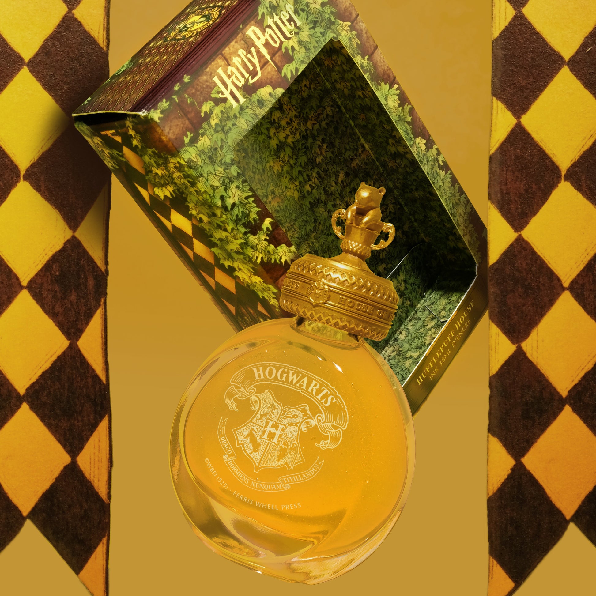 Harry Potter Hogwarts Hufflepuff themed ink bottle and packaging on a checkered background