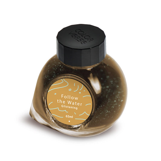Ink bottle labeled 'Follow the Water Glistening' with a black cap on a white background