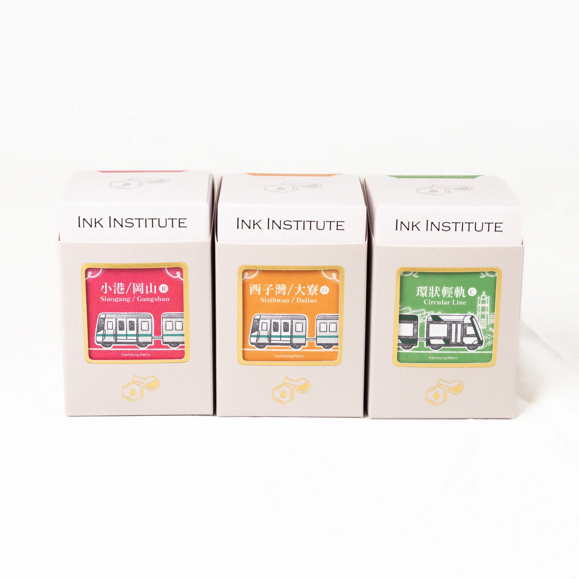 Three boxes from the Ink Institute on a white background
