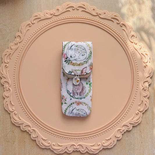 Decorative pen case with rabbit design on a decorative pink frame