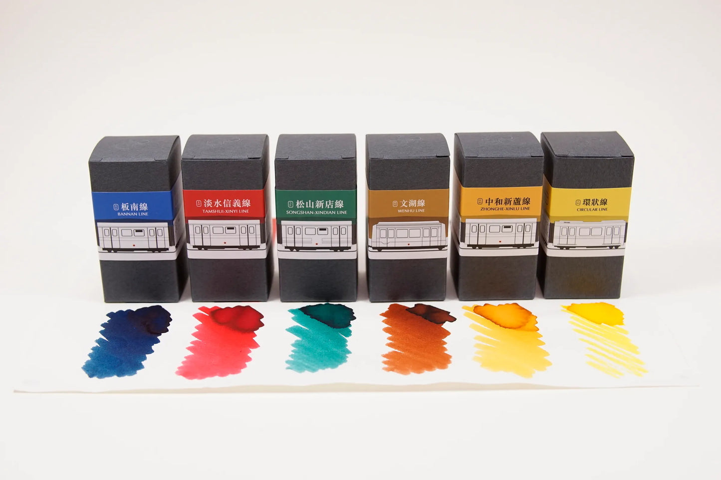 Set of ink bottles with color swatches on a white background