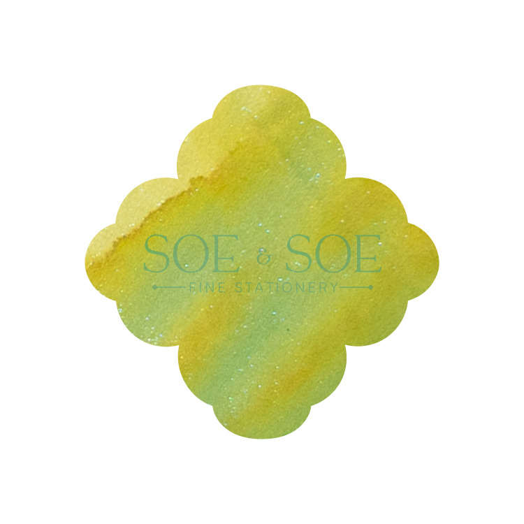 Flower-shaped yellow and greenink swatch with 'SOE & SOE' branding on a white background
