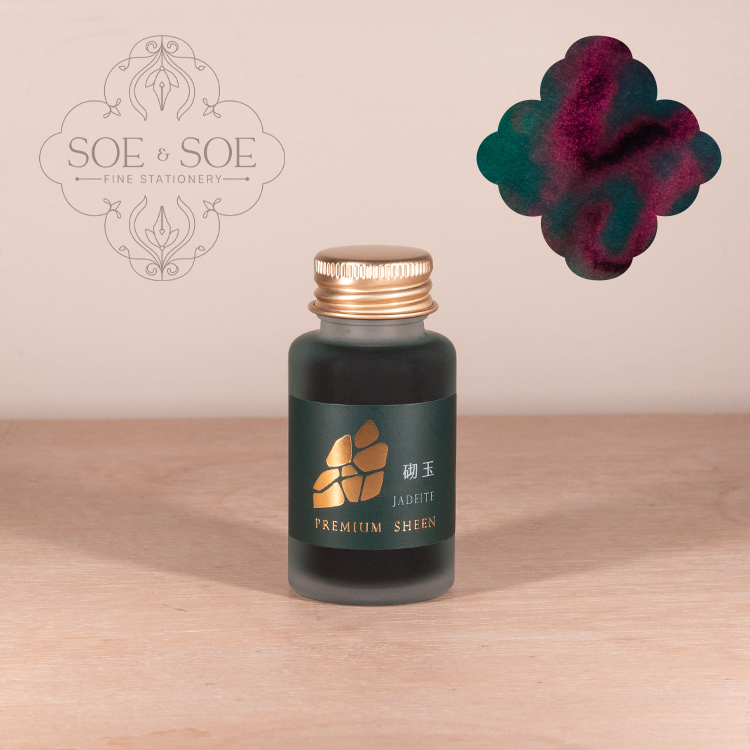 Bottle of Ink Institute Jadeite on a wooden surface with a ink swatch.