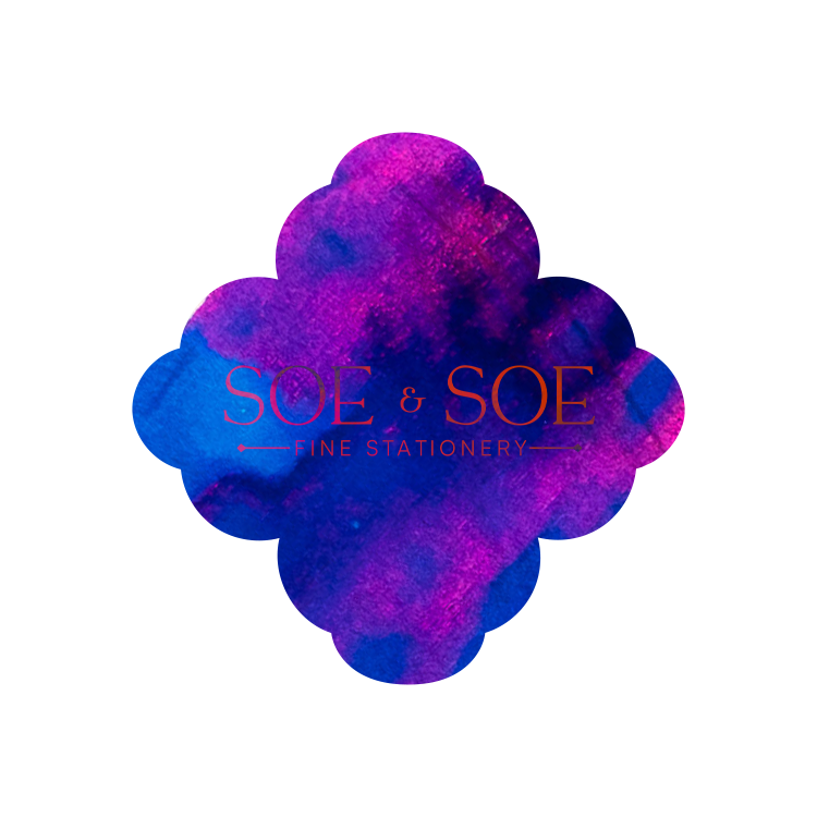 Logo of SOE & SOE Fine Stationery with a purple and blue ink swatch shape on a white background.