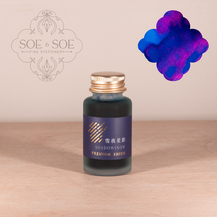 Ink Institute Shadowsnow bottle with purple label on a wooden surface, featuring the 'SOE & SOE' brand.