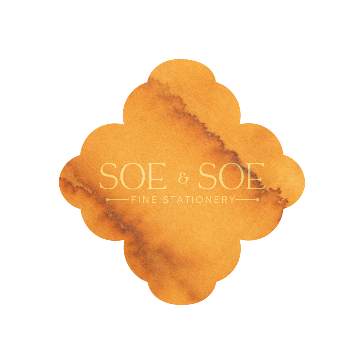 Orange ink swatch with 'SOE & SOE Fine Stationery' text on a white background