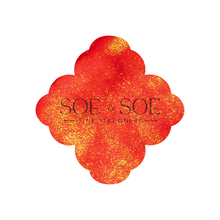 Floral-shaped red and gold ink swatch with 'SOE & SOE' branding on a white background