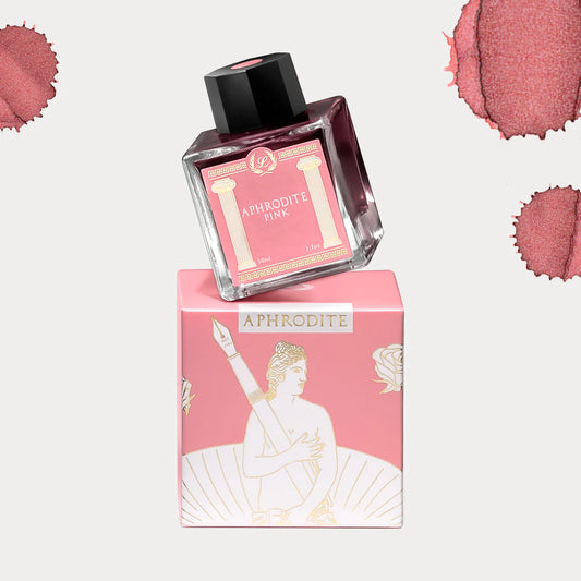 Bottle of Laban Aphrodite Pink ink on top of packaging with ink swatches in the background