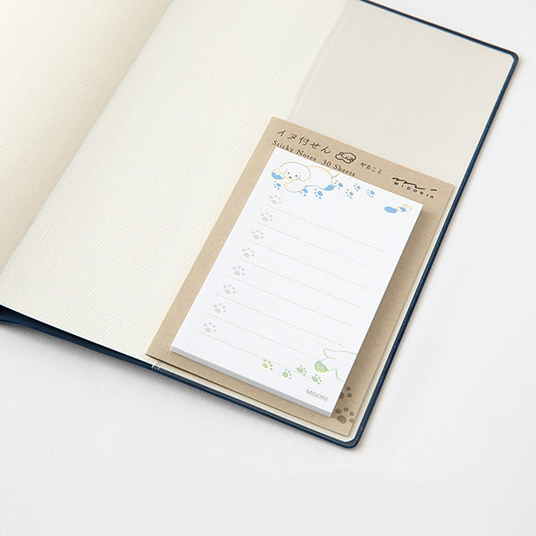 Notebook with a sheet of sticky notes attached on a white background