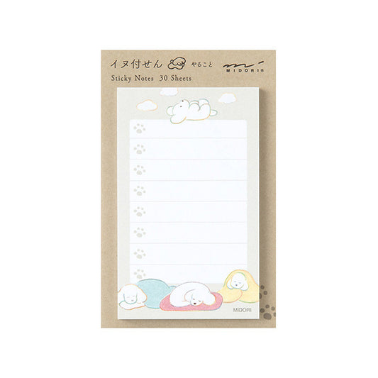 Sticky notes with cartoon fluffy dog designs on a white background