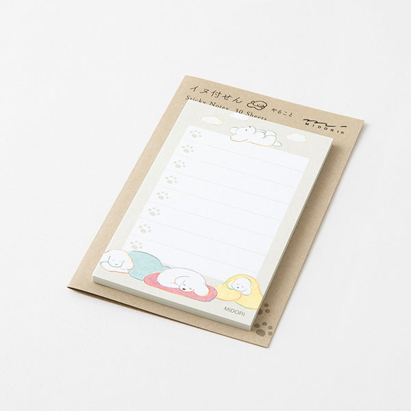 Small sticky note with cartoon dog illustrations on a white background