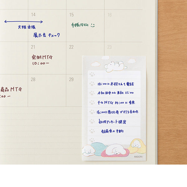 Calendar with a sticky note attached, featuring cartoon characters and text.